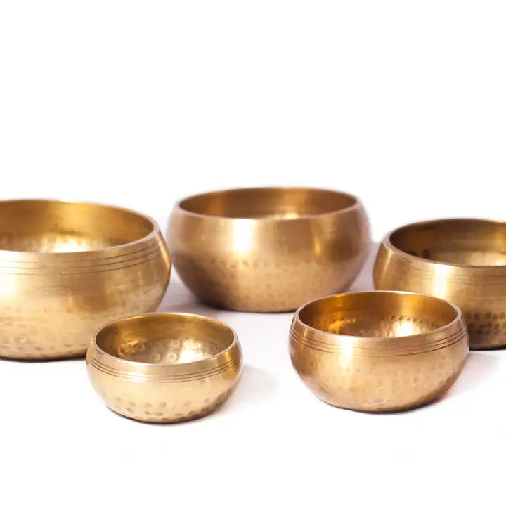 Hammer Beating Singing Bowl